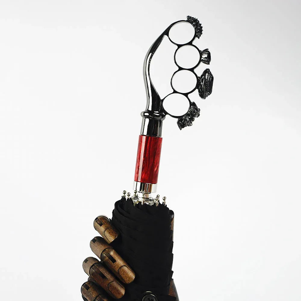 The luxury gothic folding umbrella featuring the iconic ring handle with a red wood accent.