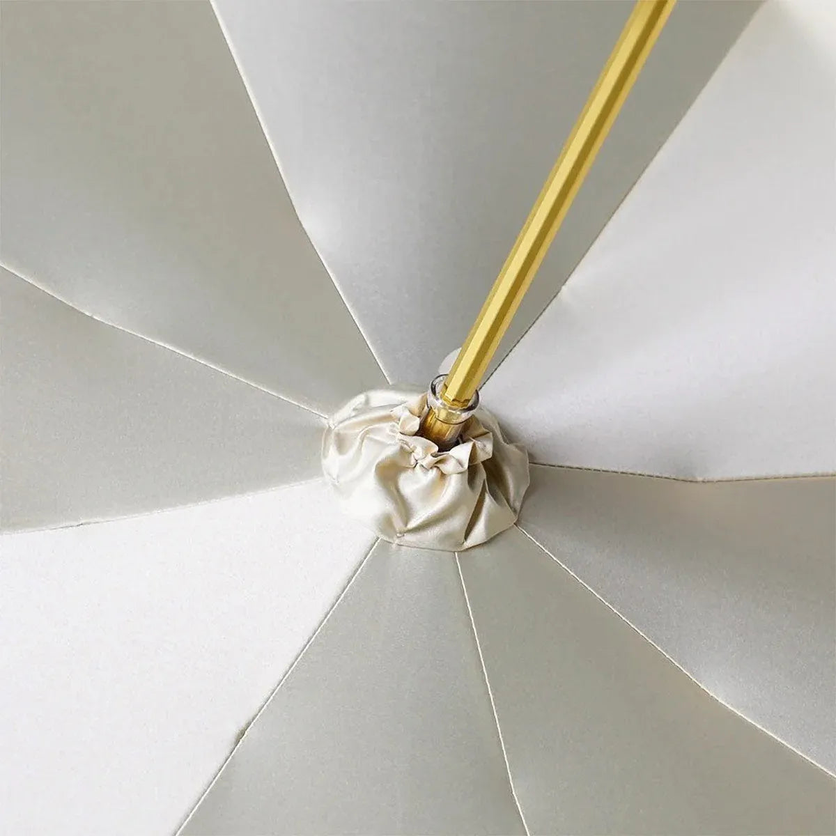 View from underneath looking up at the central mechanism and cream-colored inner canopy.