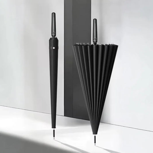 Minimalist shot of the black 24-rib auto-open umbrella, showing both open and closed views side-by-side.