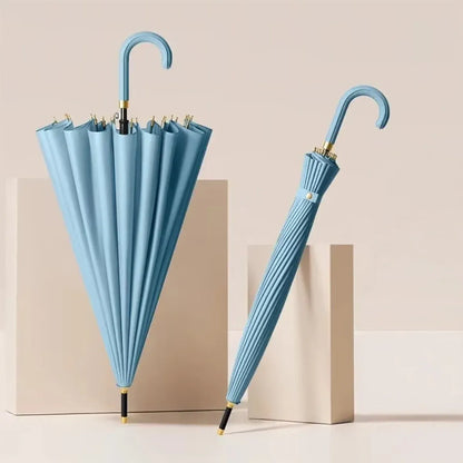 The 24-rib ladies storm proof umbrella with a leather crook handle in a soft light blue color.