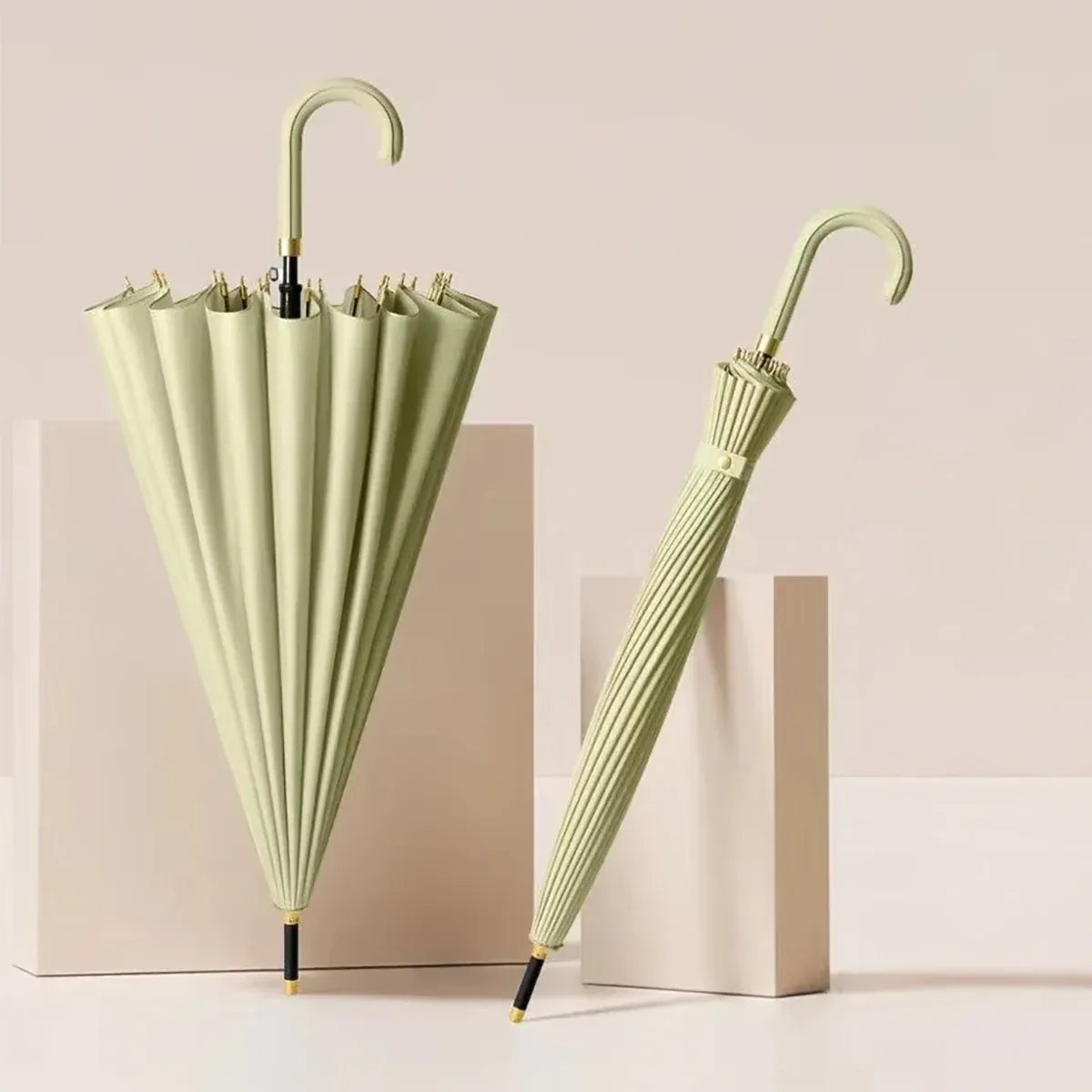 The 24-rib ladies storm proof umbrella with a leather crook handle in a delicate sage green color.