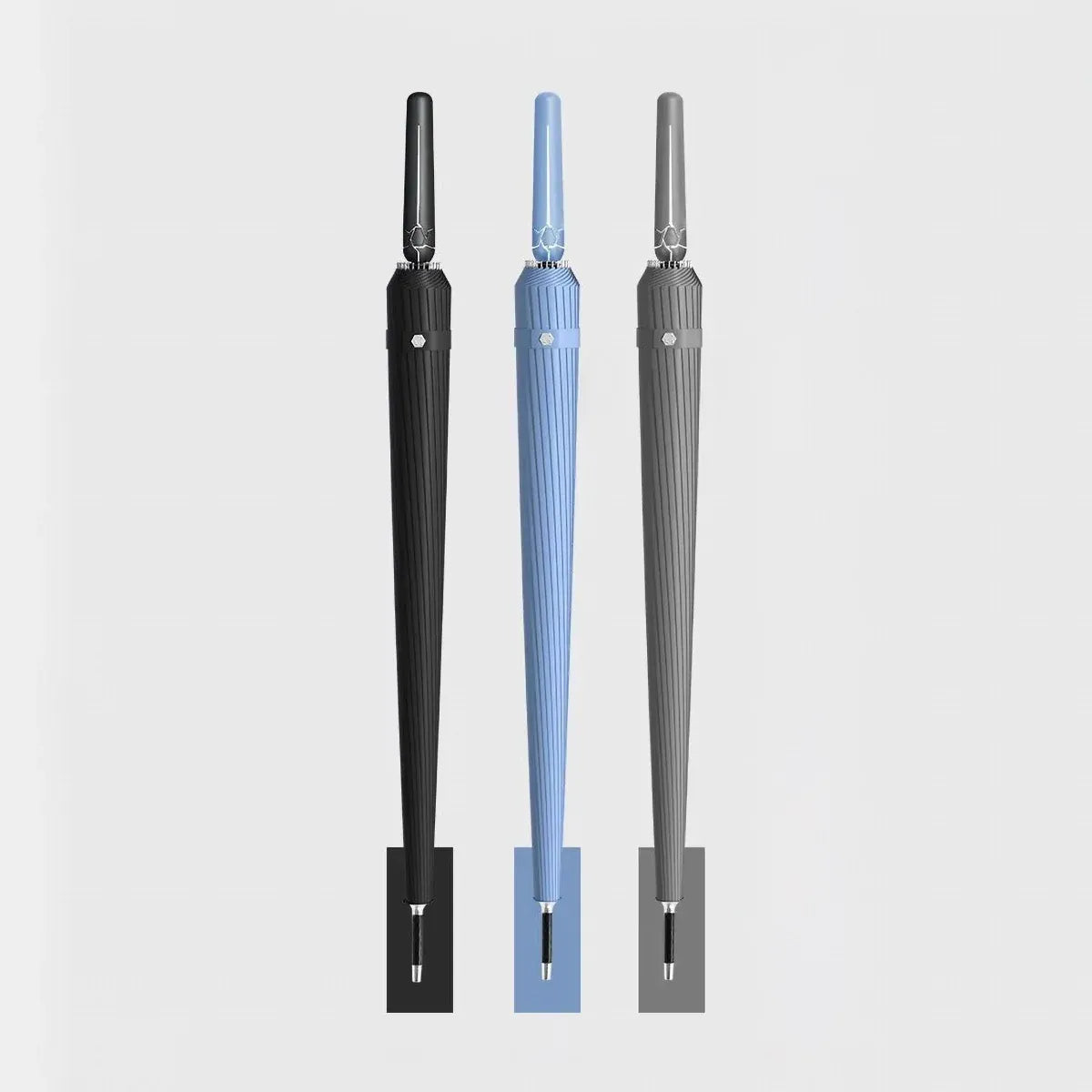 The 24-rib long handle storm umbrella shown in black, blue, and grey color options, side-by-side.