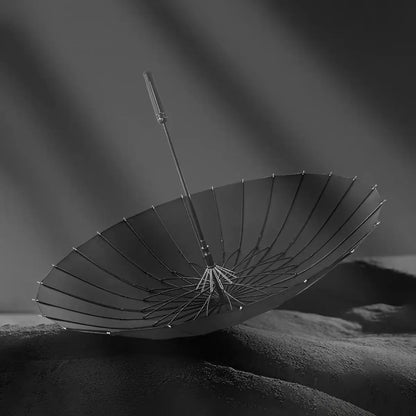 Dramatic view of the open black canopy and durable fiberglass structure of the 24-rib storm umbrella.