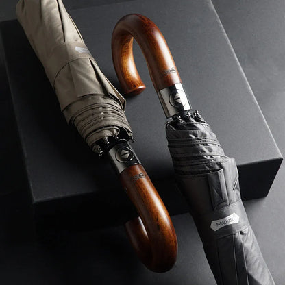 The black and khaki versions of the 48-inch automatic umbrella, showing the wooden hook handles.