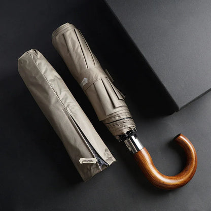 The closed 48-inch khaki umbrella shown next to its matching protective sleeve with a zipper.