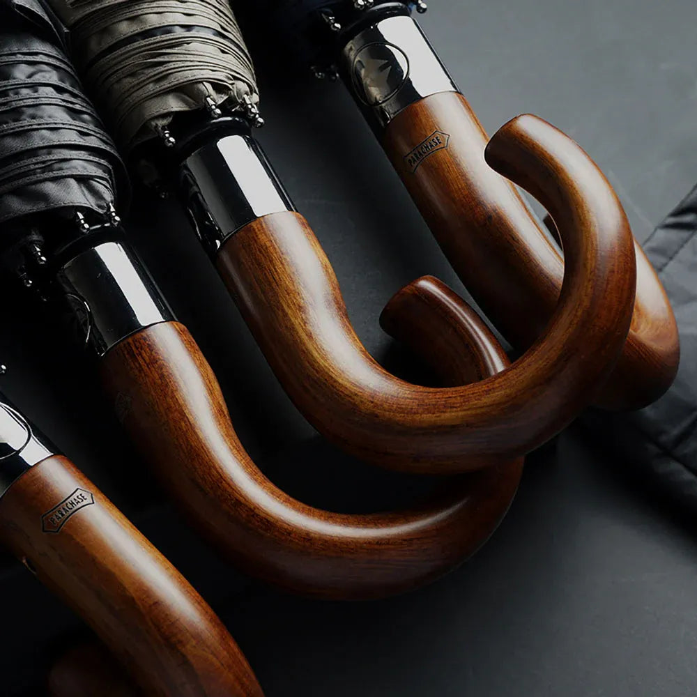 An assortment of the classic wooden hook handles, highlighting the quality craftsmanship and wood grain.