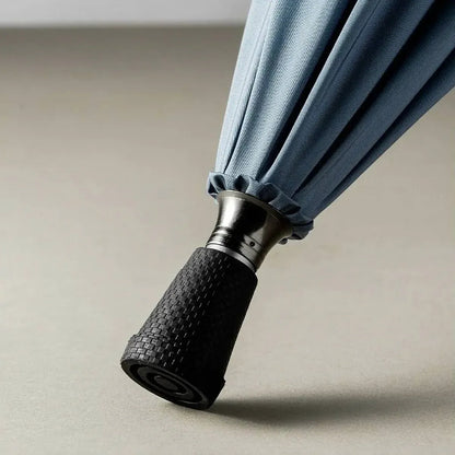 Detailed close-up of the non-slip textured rubber tip of the walking cane umbrella for enhanced safety.