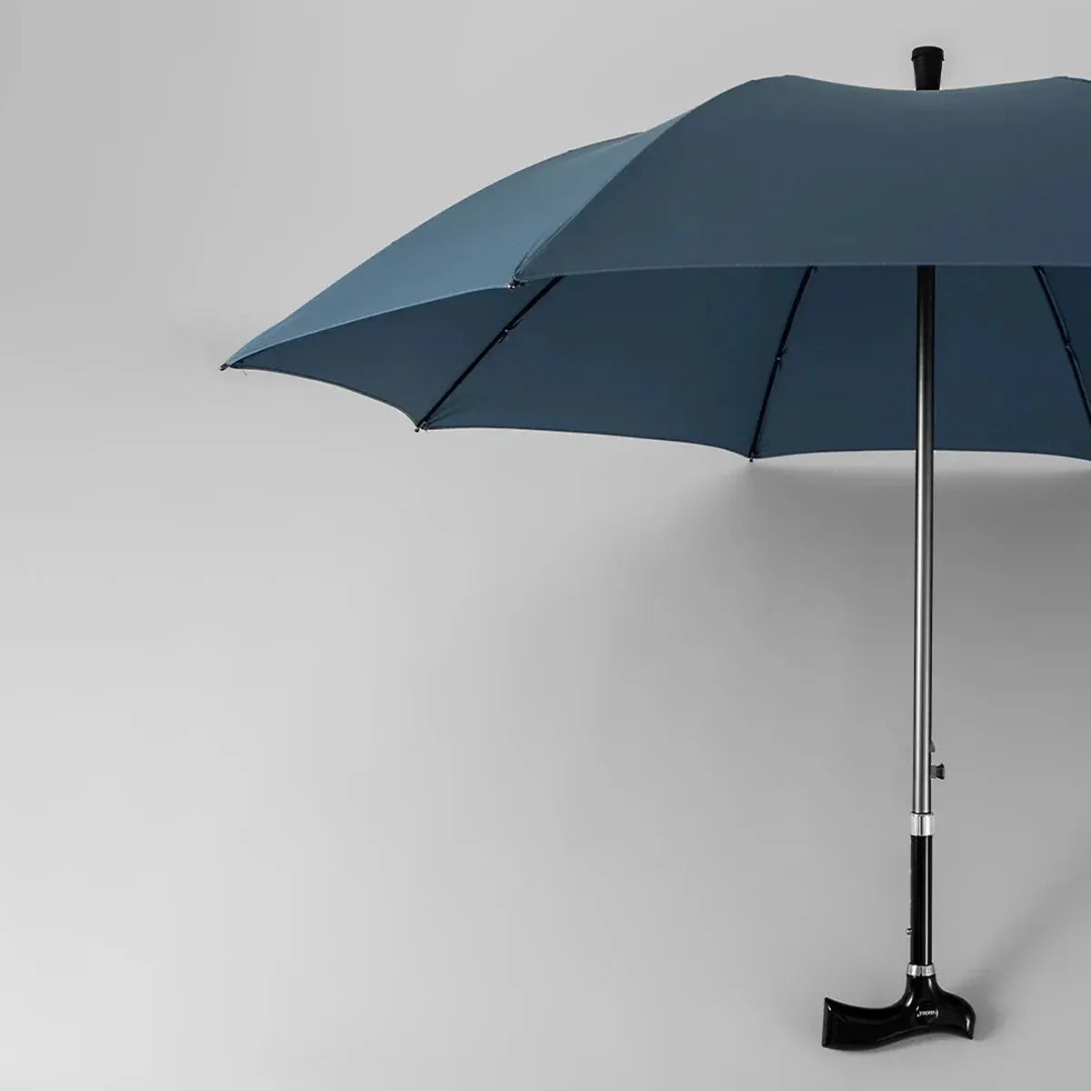 Full view of the open navy blue walking stick umbrella, showing its large 45-inch protective canopy.