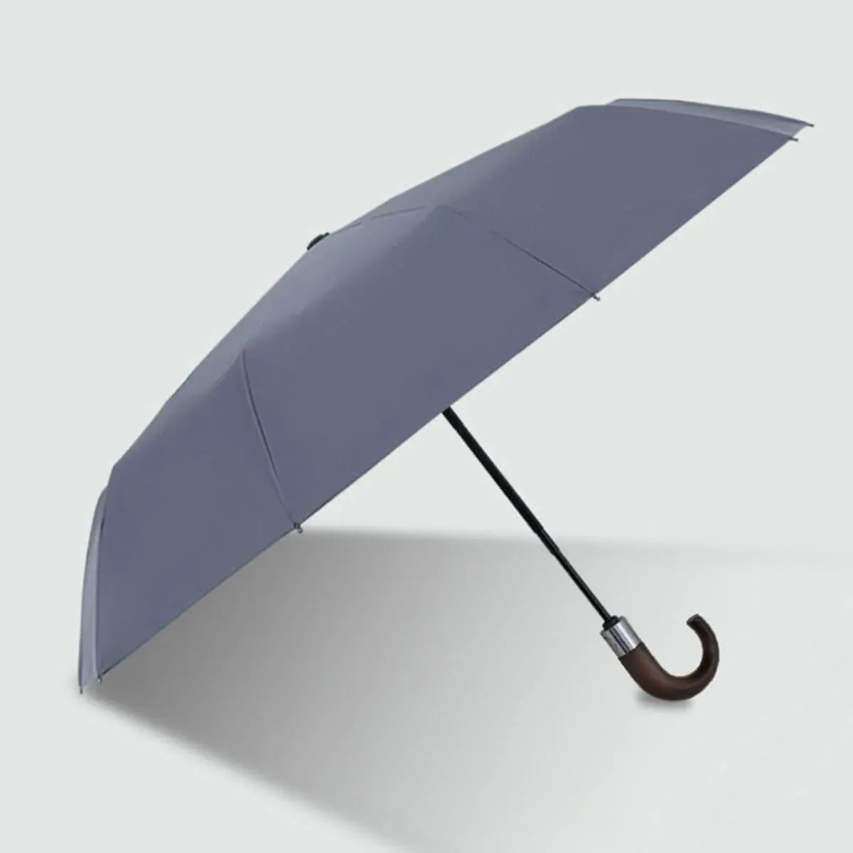 Full view of the grey 10-rib automatic folding umbrella with a natural wood hook handle.
