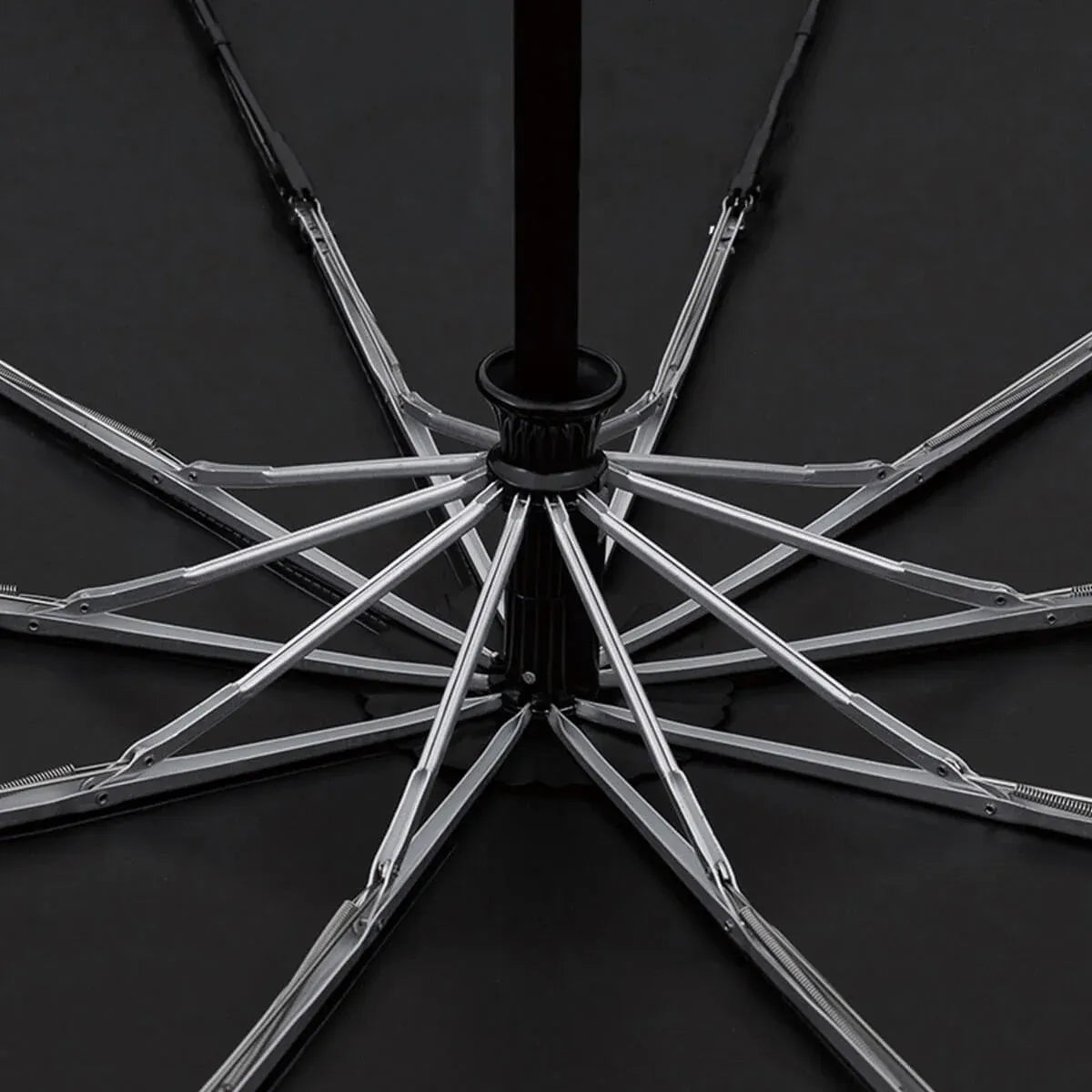 View from underneath the open canopy, revealing the 10-rib windproof aluminum and fiberglass frame.