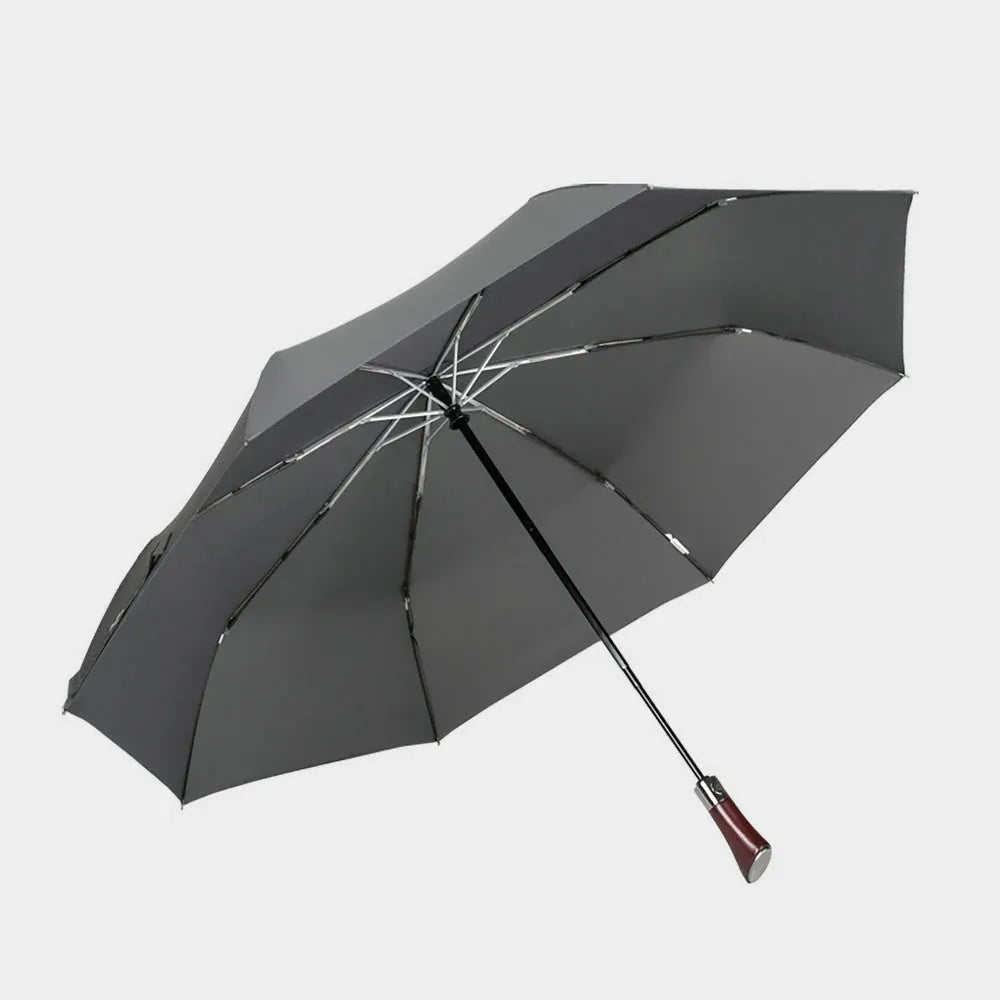 Full profile view of the open large automatic folding umbrella in grey with a wood handle.