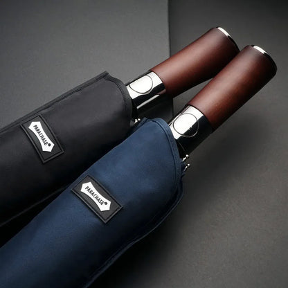 The black and navy blue umbrella sleeves, showing the durable fabric and logo tag.