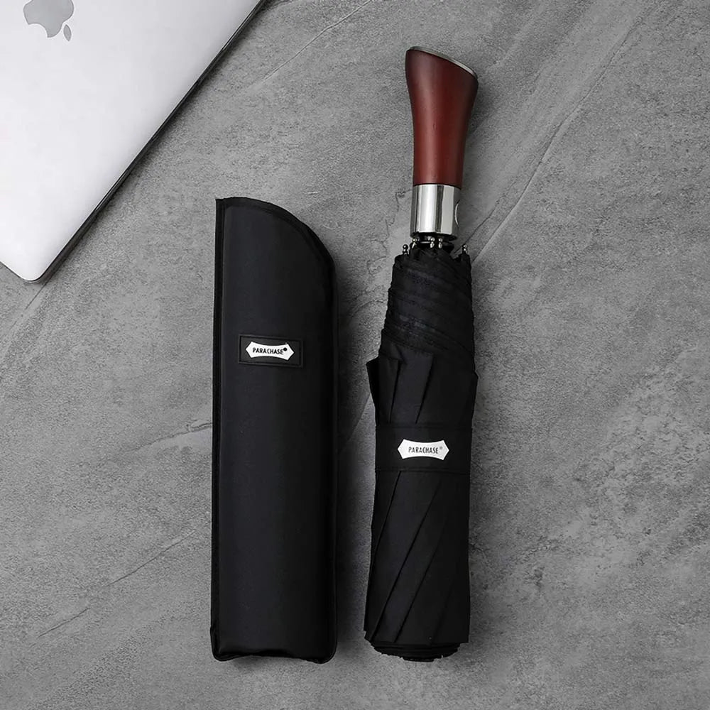 The large 48-inch automatic folding umbrella in black, shown closed with its matching carrying sleeve.