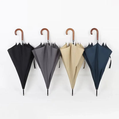All four color options of the classic stick umbrella with wooden crook handles, hanging closed.