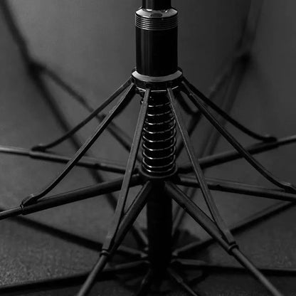 Close-up of the durable fiberglass frame and spring mechanism on the central aluminum stick.