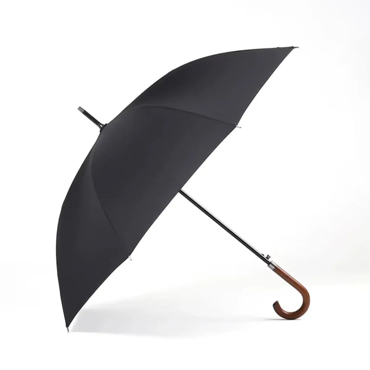 The classic stick umbrella with a solid wooden crook handle, shown in a timeless black color.