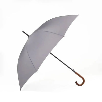 The classic stick umbrella with a solid wooden crook handle, shown in a modern grey color.