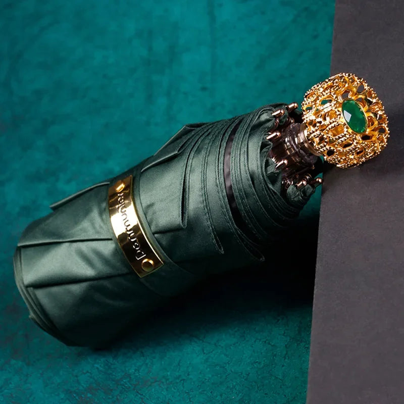 Compact luxury mini umbrella in green, perfect for style-conscious individuals.