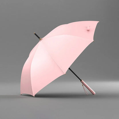 Angled profile view of the open pink elegant long handle umbrella.