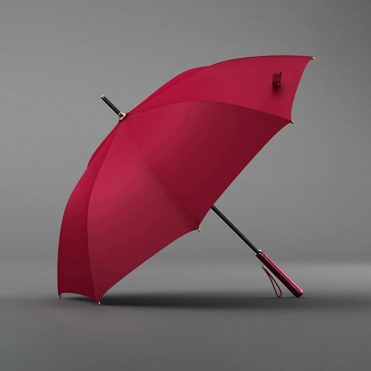 Angled profile view of the open red elegant long handle umbrella.