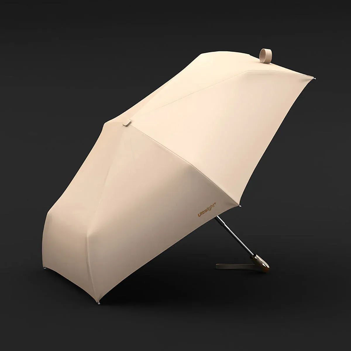 The lightweight elegant travel umbrella for women shown open in beige color against a dark background.