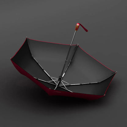 View from underneath the open red canopy showing the black lining and lightweight frame.