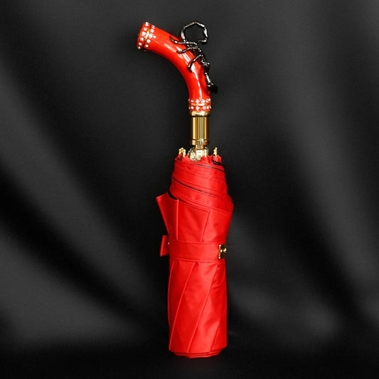 Fancy red umbrella with a unique scorpion-shaped handle, perfect for stylish rain protection.