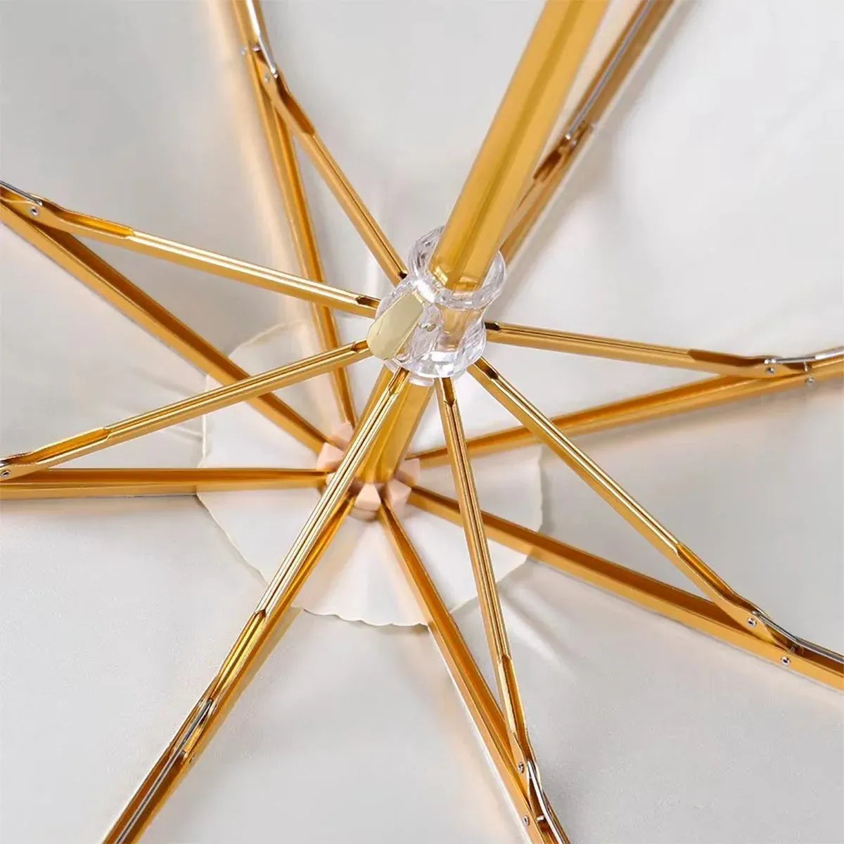 View from underneath the open canopy showing the golden aluminum alloy frame structure.