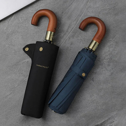 The black and navy blue foldable automatic umbrellas shown closed, one inside its sleeve.