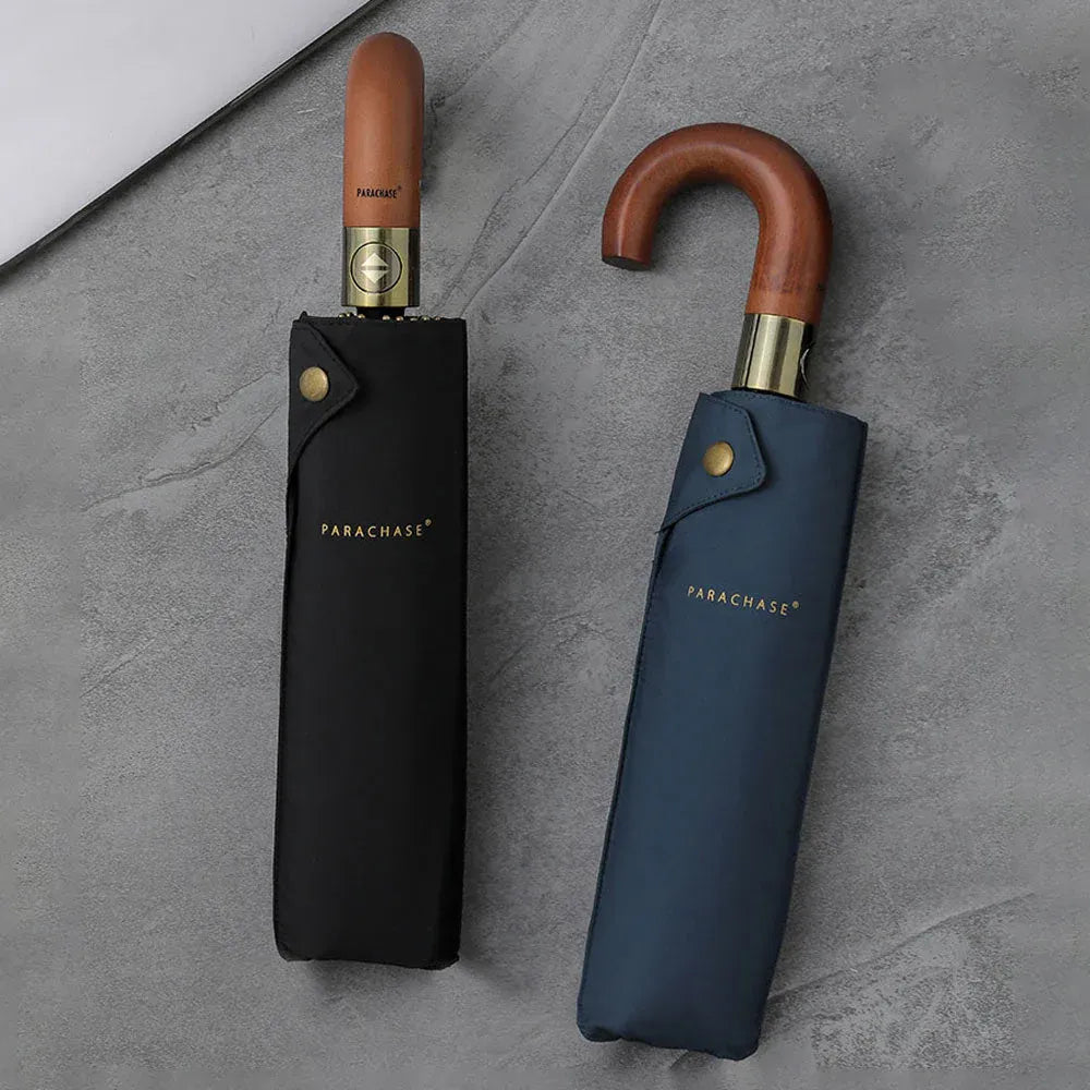 The black and navy blue foldable automatic umbrellas shown closed inside their elegant sleeves.