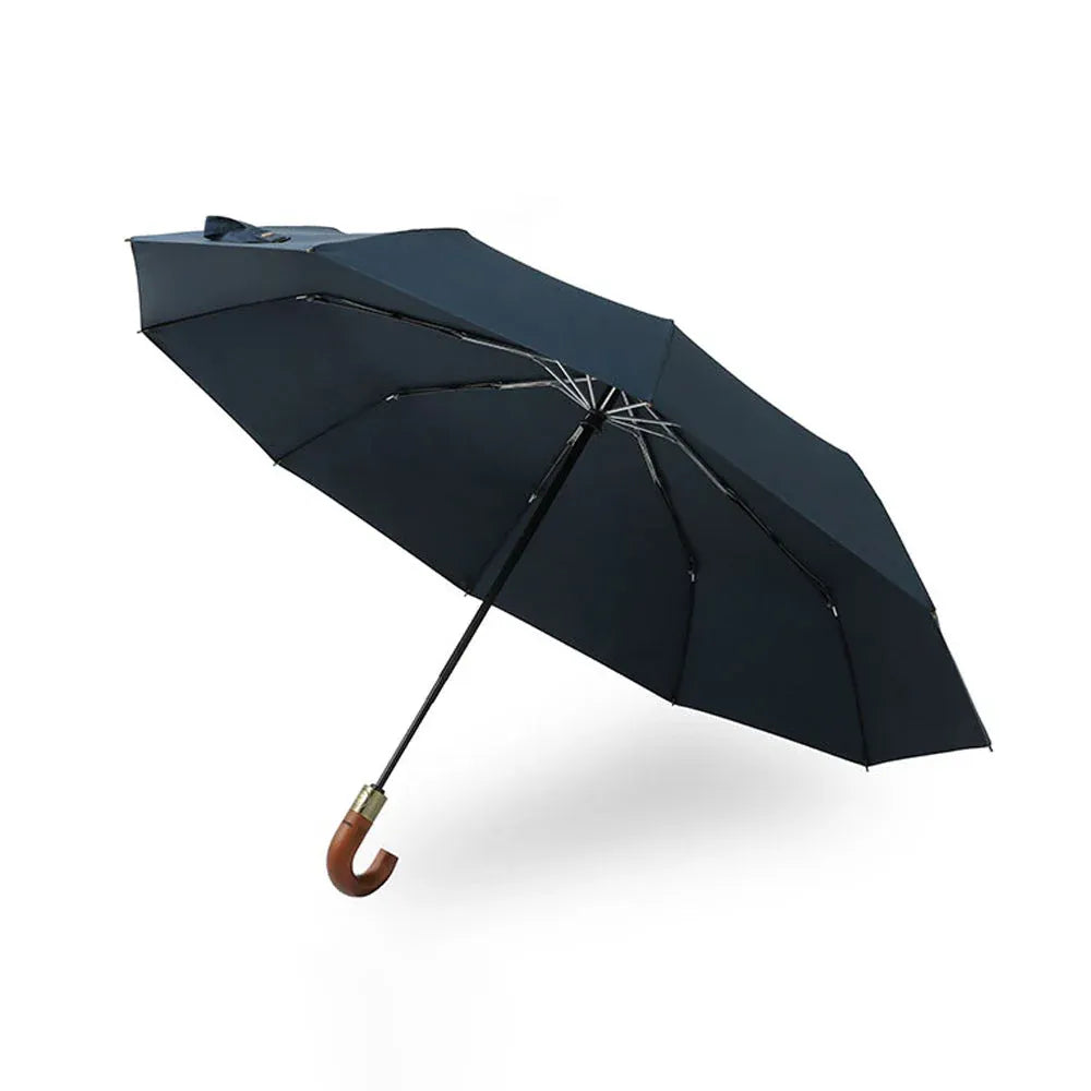 Profile view of the open navy blue 10-rib foldable automatic umbrella with a wooden handle.