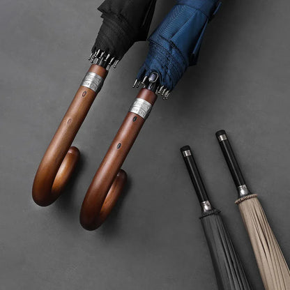 Detail shot showing the closed canopy and handle details of the Gentleman's umbrella in various colors.