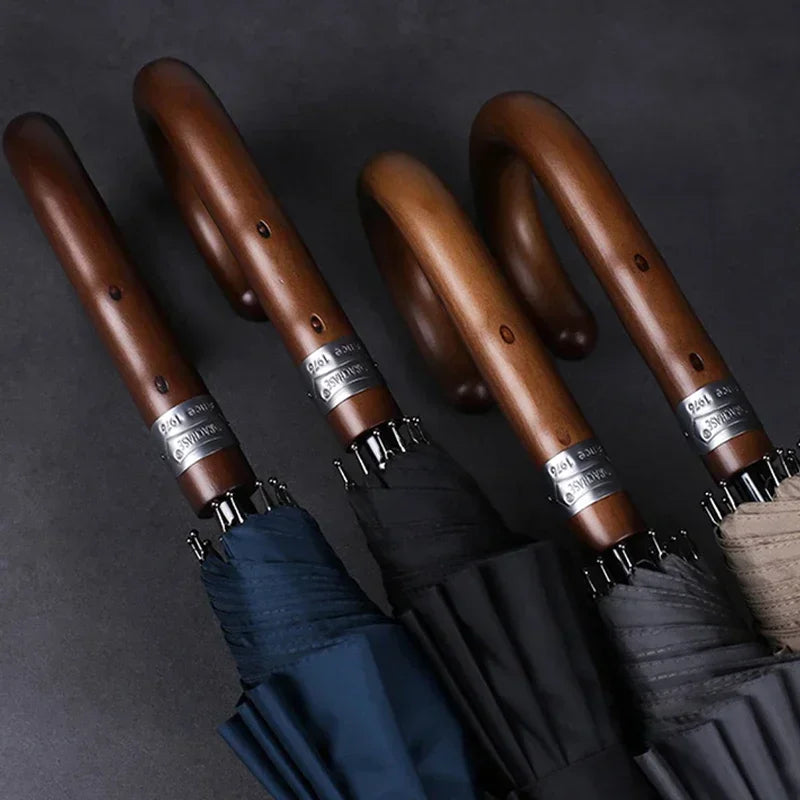 Close-up of the handmade wooden handle on the gentleman's walking umbrella.