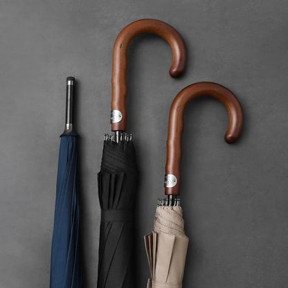 Comparison showing the natural wood crook handles of the black, khaki, and navy umbrellas.