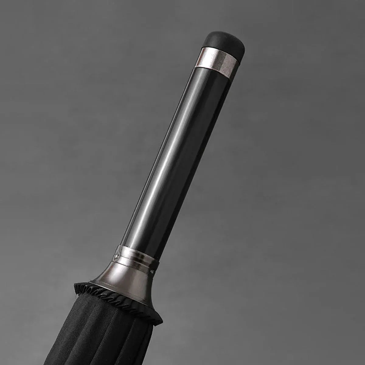 Close-up of the elegant top tip (ferrule) of the Gentleman's walking umbrella.