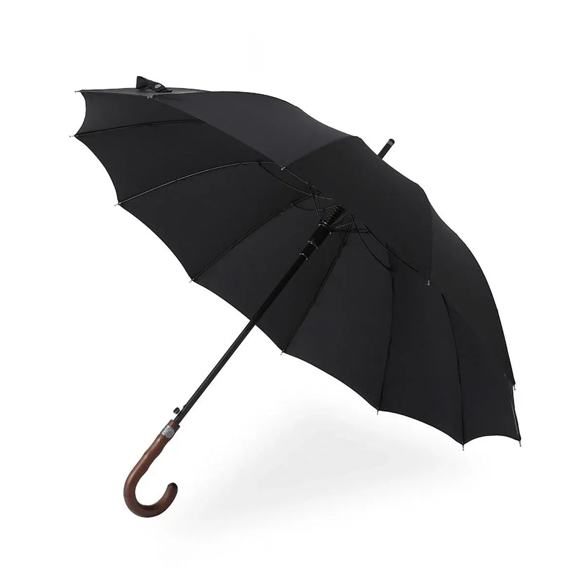 The Gentleman's walking umbrella with a handmade wooden handle, shown open in classic black.