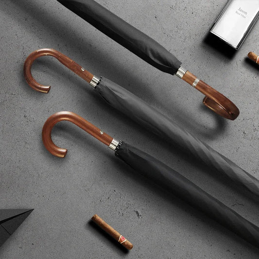 Gents black umbrella with classy wooden crook handle and premium design.