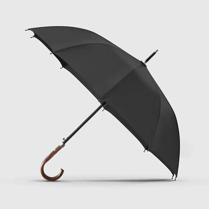 Profile view of the open Gents Black Umbrella with its classy wooden crook handle.