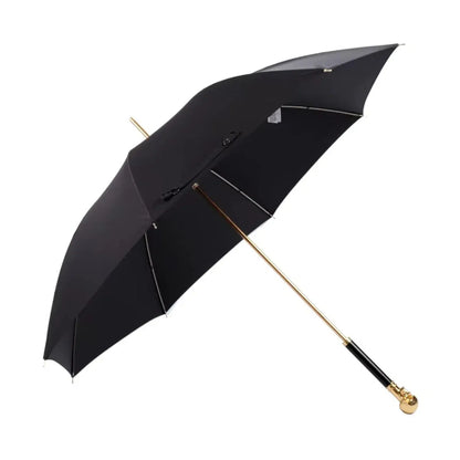 Full profile view of the open black canopy on the Gold Skull Handle umbrella with ebony grip.