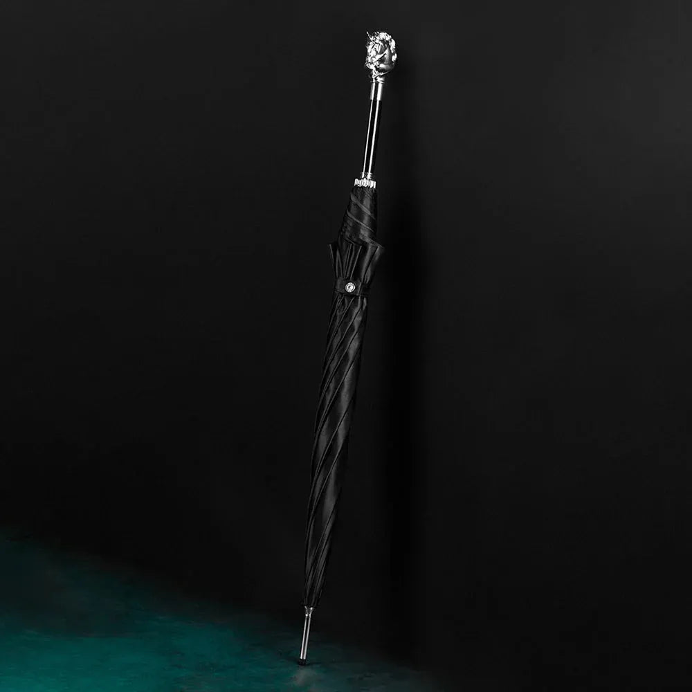 Full profile view of the closed black stick umbrella featuring the silver horse head handle.