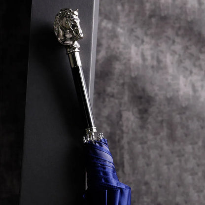The elegant stick umbrella with a silver horse head handle, shown closed in blue.