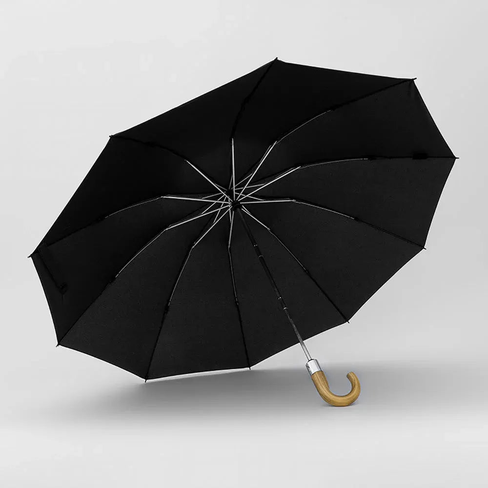 Angled profile view of the open black 10-rib inverted umbrella with wooden handle.