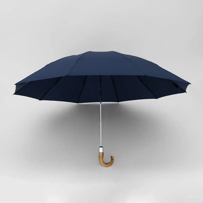 The automatic inverted umbrella with wooden J-handle, shown open in sophisticated navy blue.
