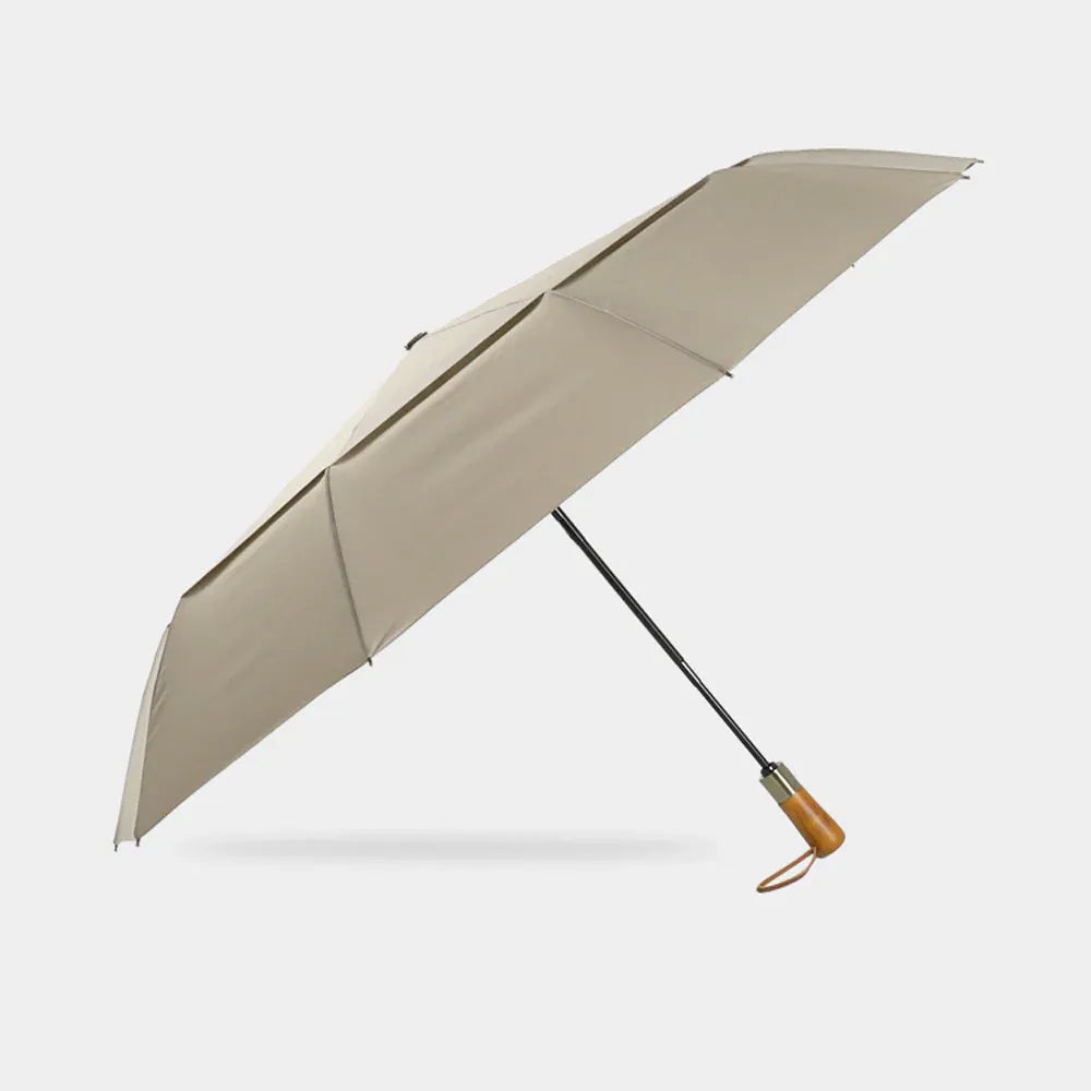 Full profile view of the open large automatic folding umbrella in khaki with wood handle.