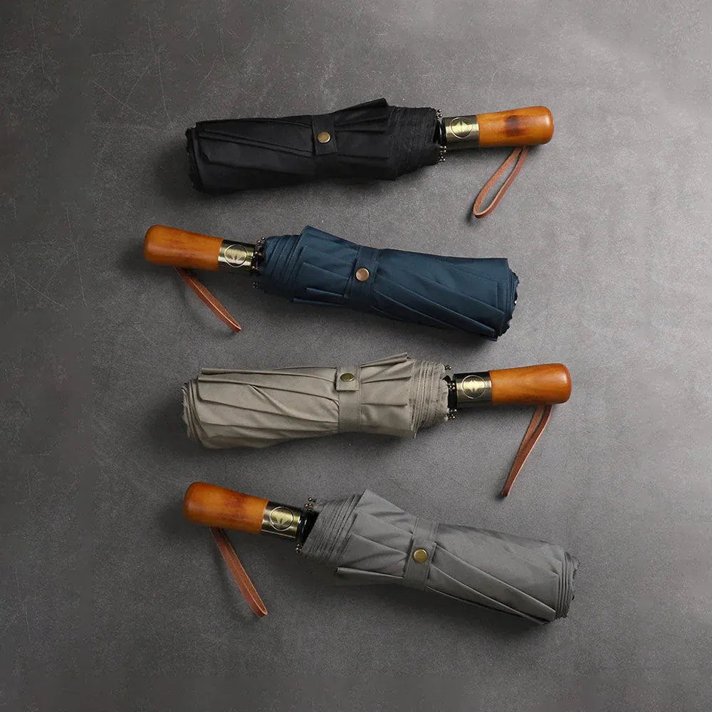 Top-down view of the closed large folding umbrellas in black, blue, grey, and khaki.