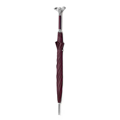 Full length view of the closed luxury burgundy umbrella featuring the silver angel handle.