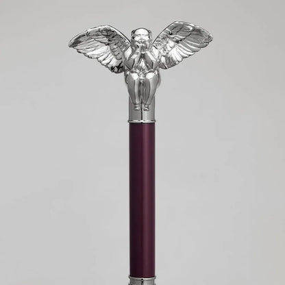 Detailed close-up of the intricately sculpted silver angel handle on the burgundy umbrella shaft.