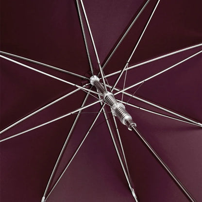 View from underneath the open burgundy canopy showing the durable frame structure.