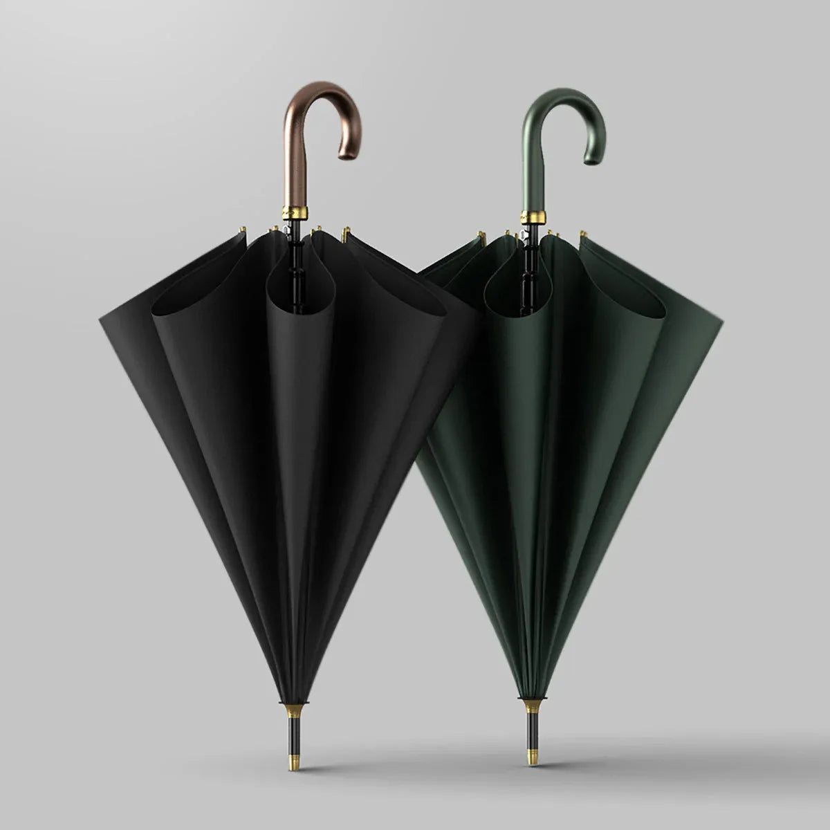The luxury leather handle umbrellas shown closed side-by-side in black and green.