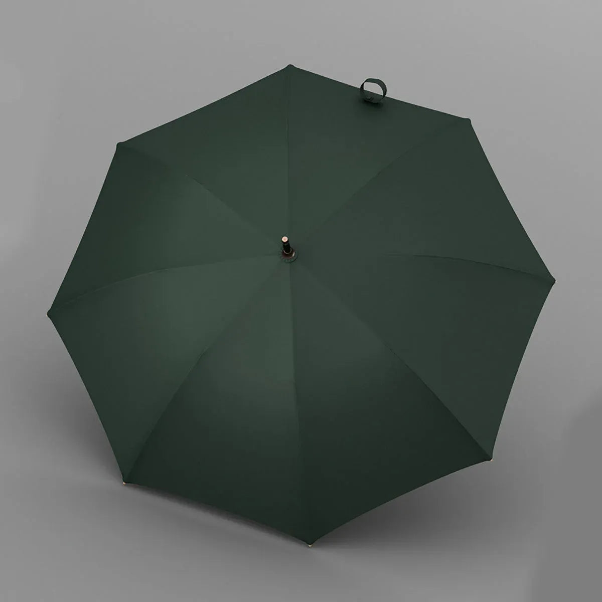 Top-down view of the open green luxury umbrella showing the 8-rib canopy.